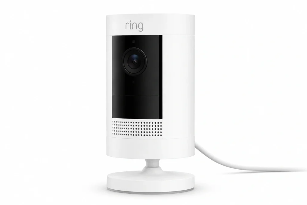 The Ring Stick Up Cam Pro, a white cylindrical battery security camera, positioned on an outdoor mount.